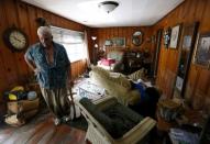 Paul Labatut stands inside his flood damaged home in St. Amant, Louisiana. REUTERS/Jonathan Bachman