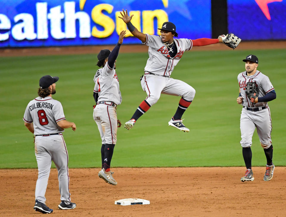 Aug 9, 2019; Miami, FL, USA; Atlanta Braves center fielder Ronald Acuna Jr. (right) celebrates with Braves second baseman Ozzie Albies (left) after the Braves defeated the Miami Marlins at Marlins Park. Mandatory Credit: Steve Mitchell-USA TODAY Sports