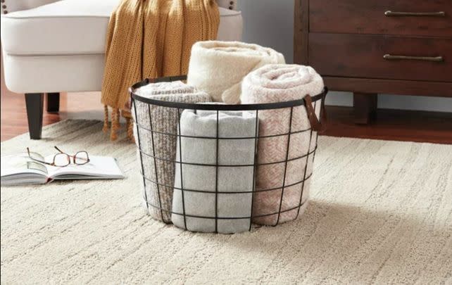 A wire basket with leather handles to add a bit of chic storage to your home