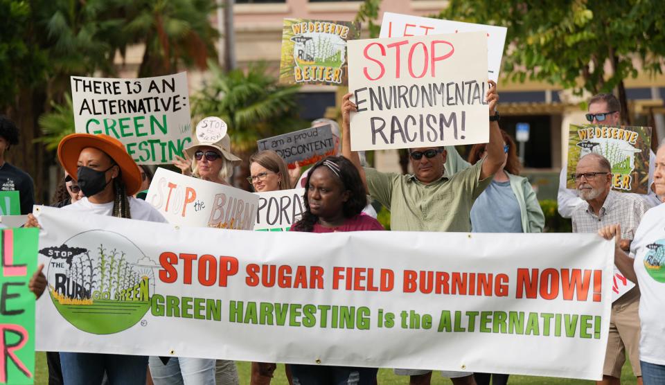 Demonstrators oppose sugar-cane burning during a protest rally Saturday in Nancy Graham Centennial Square Park in downtown West Palm Beach.
