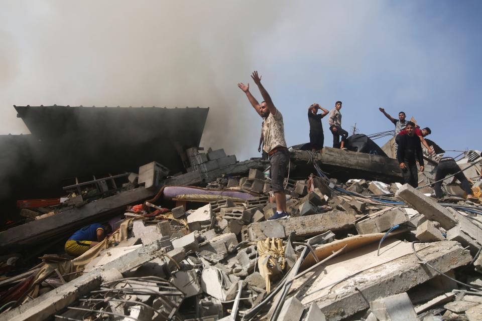 Palestinians look for survivors of the Israeli bombardment of the Gaza Strip in Rafah on Oct. 23, 2023.