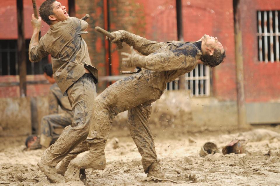 This image released by Sony Pictures Classics shows Iko Uwais as Rama, left, in a scene from The Raid 2." (AP Photo/Sony Pictures Classics)