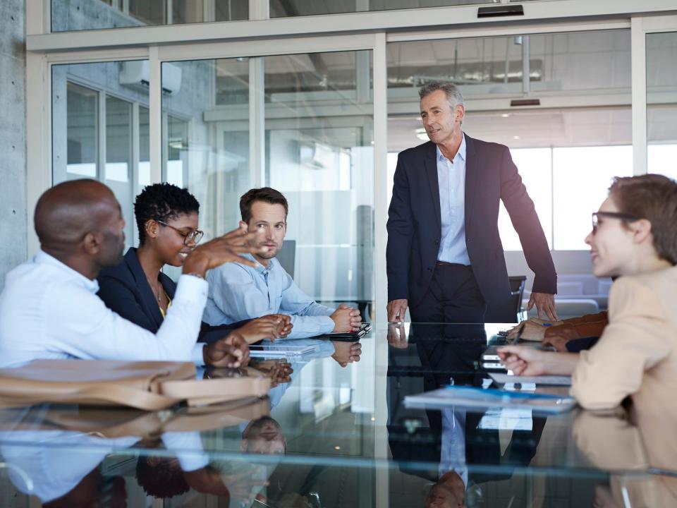 People talking in a meeting in an office