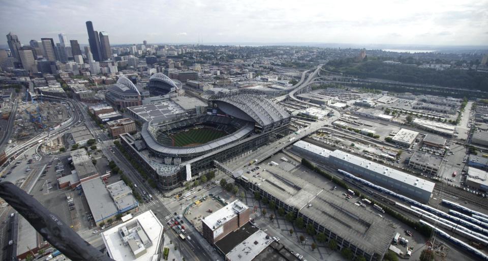 In this aerial photo taken Aug. 21, 2012, Safeco Field and CenturyLink Field, rear, are shown near downtown Seattle. A new arena in Seattle that would be built just south of Safeco Field and that could bring NBA basketball back to the city appeared a step closer to reality as Seattle Mayor Mike McGinn issued a statement late Monday, Sept. 10, 2012, saying he welcomes the news that the Seattle City Council has decided to support bringing basketball back to Seattle. (AP Photo/Ted S. Warren)