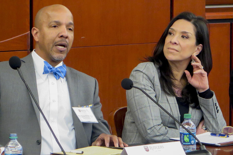 This undated photo provided by the Rutgers Law School shows U.S. District Judge Esther Salas, right, during a conference at the Rutgers Law School in Newark, N.J. with appellate Judge Thomas Sumners. On Sunday, July 19, 2020 a gunman posing as a FedEx delivery person went to Salas' North Brunswick, New Jersey home and started shooting, wounding her husband, the defense lawyer Mark Anderl, and killing her son, Daniel Anderl. (Rutgers Law School via AP)