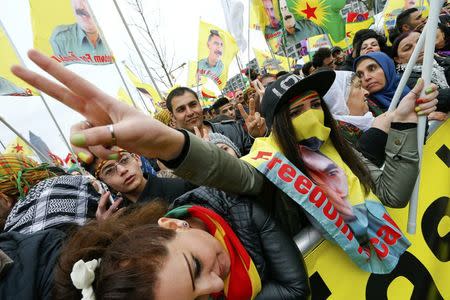 People carry flags during a demonstration organised by Kurds, in Frankfurt, Germany, March 18, 2017. REUTERS/Ralph Orlowski