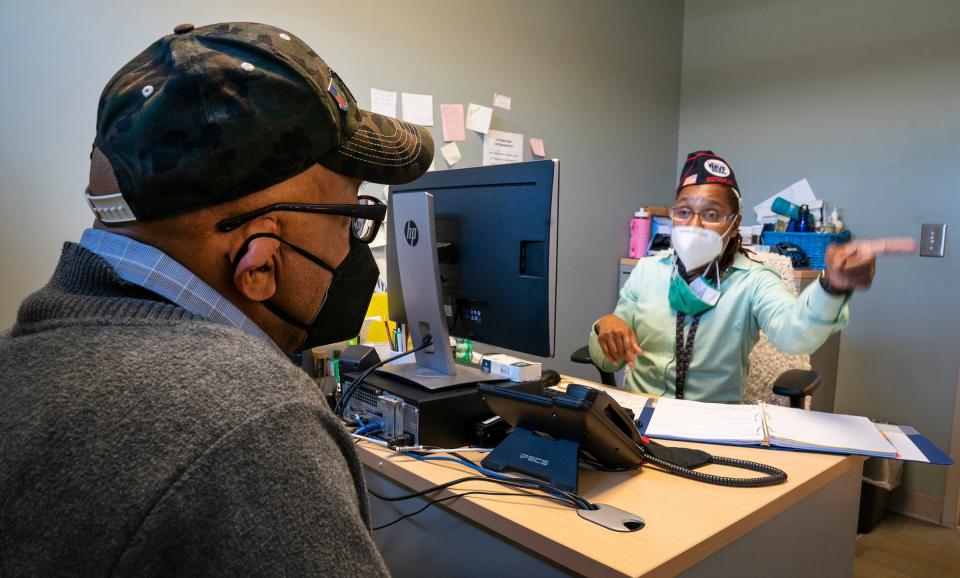 Parish Blevins, 67, of Detroit, left, who worked in the radiology department of the 323rd combat support hospital out of Southfield from 1985 to 2005, seeks assistance from Michigan Veterans Foundation case manager Samantha Winston on Tuesday, Aug. 29, 2023, in Detroit. Staff at the Michigan Veterans Foundation in Detroit work hard the whole year round to make life better for veterans who rely on their services.