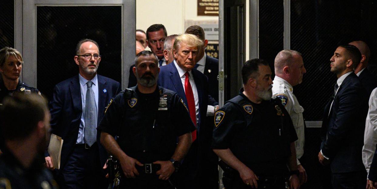 former us president donald trump makes his way inside the manhattan criminal courthouse in new york on april 4, 2023 donald trump will make an unprecedented appearance before a new york judge on april 4, 2023 to answer criminal charges that threaten to throw the 2024 white house race into turmoil photo by ed jones afp photo by ed jonesafp via getty images