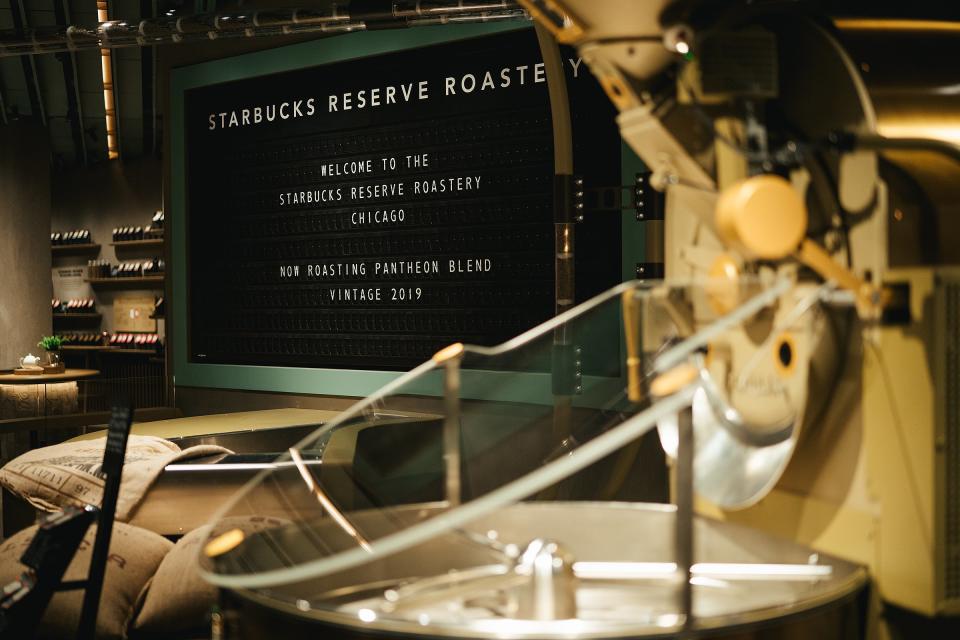 A train station-like timetable greets guests and explains what coffee is being roasted as they walk into the space. Roasters make up some of the 200 staffers at the giant location.