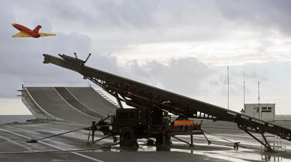 A Banshee drone is fired from a catapult launcher on the deck of HMS <em>Prince of Wales</em> during a demonstration in 2021. <em>Crown Copyright</em>