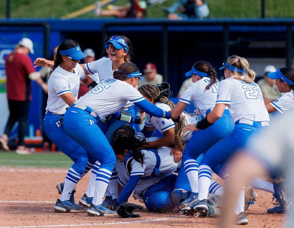 Duke players celebrate following the Blue Devils’ 6-3 win over Florida State in the ACC Tournament final on Saturday, May 11, 2024, in Durham, N.C.