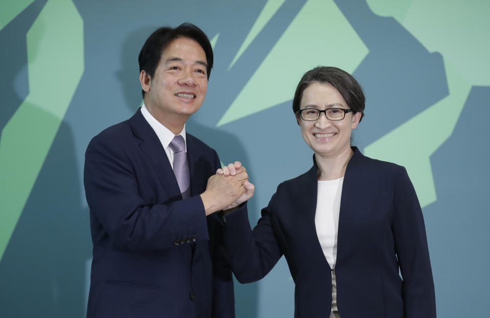Taiwan Vice President William Lai, left, the candidate for presidential election of the ruling Democratic Progressive Party (DPP), poses with his vice president candidate Hsiao Bi-kim, former Taiwanese representative to the United States, during a news conference in Taipei, Taiwan, Monday, Nov. 20, 2023. (AP Photo/Chiang Ying-ying)