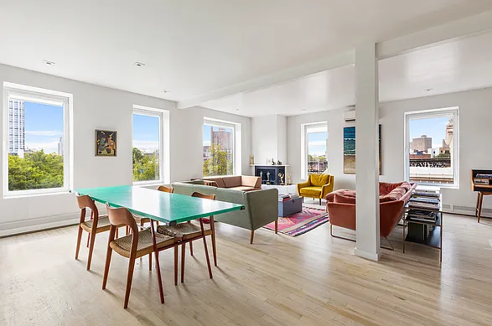 White-washed oak flooring and neutral decor provides a minimalist backdrop for the actor’s awards collection (Zillow)