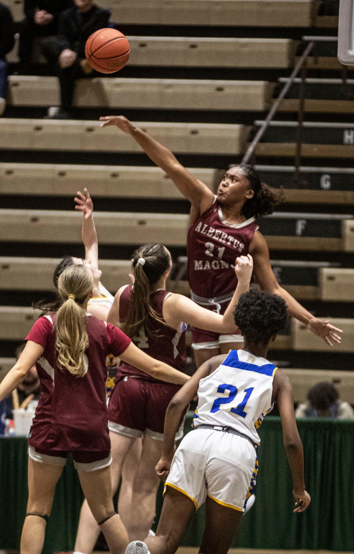 Mikaiya Beasley of Albertus Magnus blocks a shot against East Meadow in a New York State girls Class AA basketball semifinal at Hudson Valley Community College in Troy March 15, 2024. Albertus Magnus defeated East Meadow 89-51 to advance to the Class AA final on Saturday.