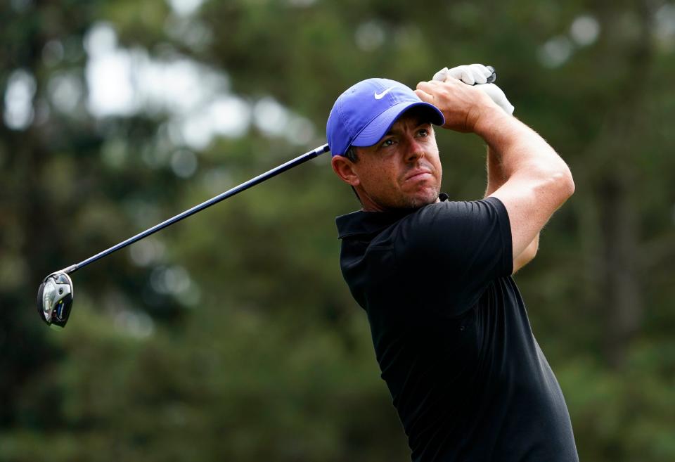 Apr 8, 2021; Augusta, Georgia, USA; Rory McIlroy hits his tee shot on the 18th hole during the first round of The Masters golf tournament. Mandatory Credit: Michael Madrid-USA TODAY Sports