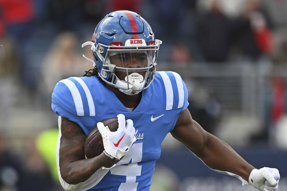 FILE - Mississippi running back Quinshon Judkins (4) runs the ball during the first half of an NCAA college football game against Alabama in Oxford, Miss., Saturday, Nov. 12, 2022. Quinshon Judkins was named to The Associated Press preseason All-America team, Monday, Aug. 21, 2023. (AP Photo/Thomas Graning, File)