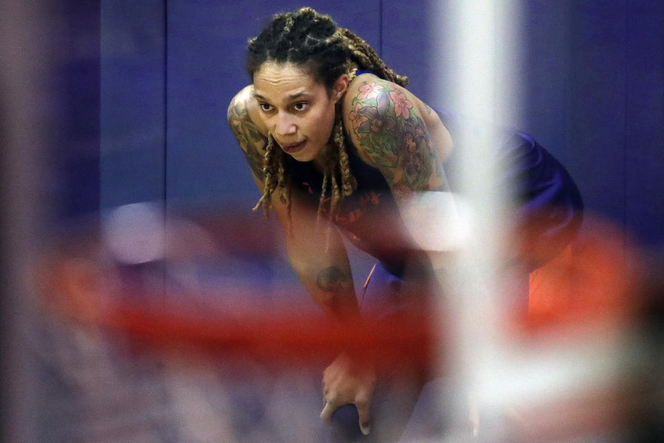 FILE - Phoenix Mercury's Brittney Griner watches during WNBA basketball practice on May 10, 2018, in Phoenix. The WNBA will begin its 26th season this weekend with many fascinating storylines including the potential retirement of Sue Bird and Sylvia Fowles, the return of Becky Hammon as a coach and the absence of Brittney Griner. (AP Photo/Matt York, File)