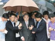 FILE PHOTO: Lee Kun-hee, former Samsung Group chairman, leaves after his trial at a Seoul court