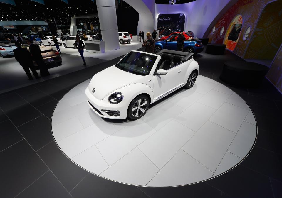 LOS ANGELES, CA - NOVEMBER 29: New 2013 Volkswagen Beetle convertibles are on display after it was revealed during the Los Angeles Auto show on November 29, 2012 in Los Angeles, California. The LA Auto Show opens to the public on November 30 and runs through December 9. (Photo by Kevork Djansezian/Getty Images)