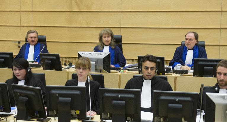 Presiding Judge Ekatarina Trendafilova (centre), Judge Hans-Peter Kaul (left)and Judge Cuna Tarfusser sit in the case against Congolese militia leader Bosco Ntaganda at the International Criminal Court in The Hague on February 10, 2014