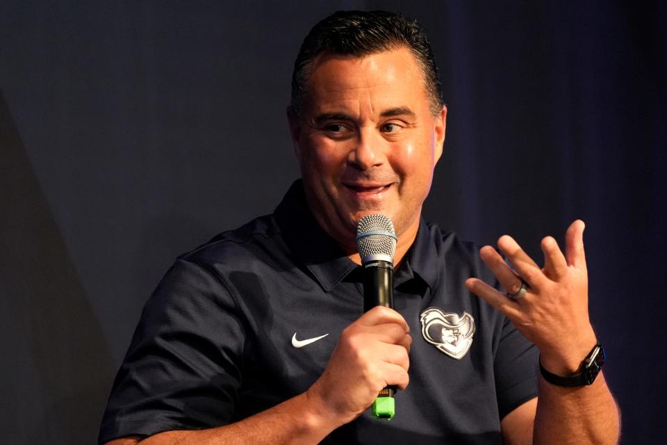 Xavier Musketeers men’s basketball head coach Sean Miller joins sports commentator Jason Benetti on stage during a Xavier University basketball preseason preview event at the Cintas Center in Cincinnati on Monday, Oct. 2, 2023.