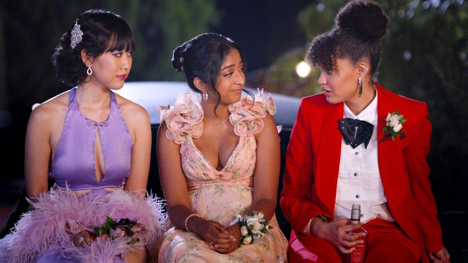 Maitreyi Ramakrishnan, Lee Rodriguez, and Ramona Young sitting together, dressed in formal attire