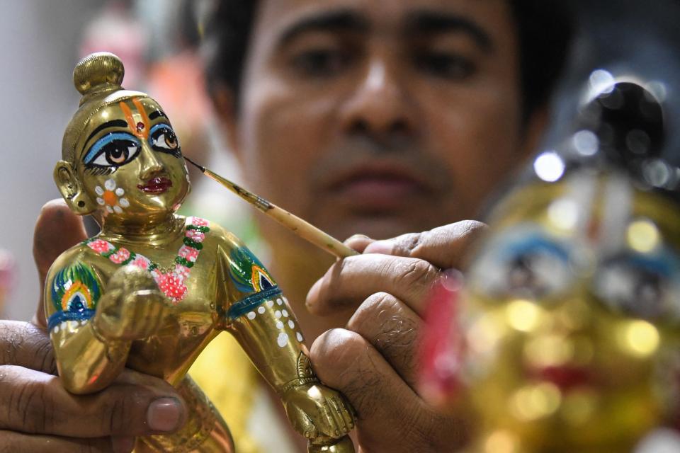 Aug. 25, 2021: An artist gives finishing touches to an idol of Hindu deity Lord Krishna at a workshop in Amritsar, India ahead of the 'Janmashtami' festival which is celebrated to mark the birth of Krishna.