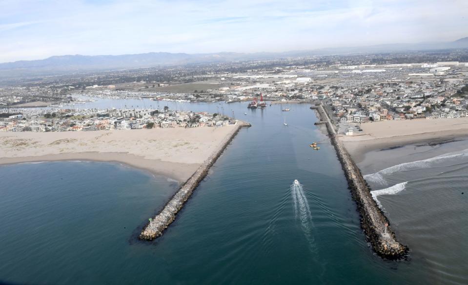 A helicopter view of the mouth of Channel Islands Harbor with the Silver Strand community, at right. A man reportedly tried to flee authorities by swimming through the harbor after crashing his car into a Silver Strand market Tuesday night.