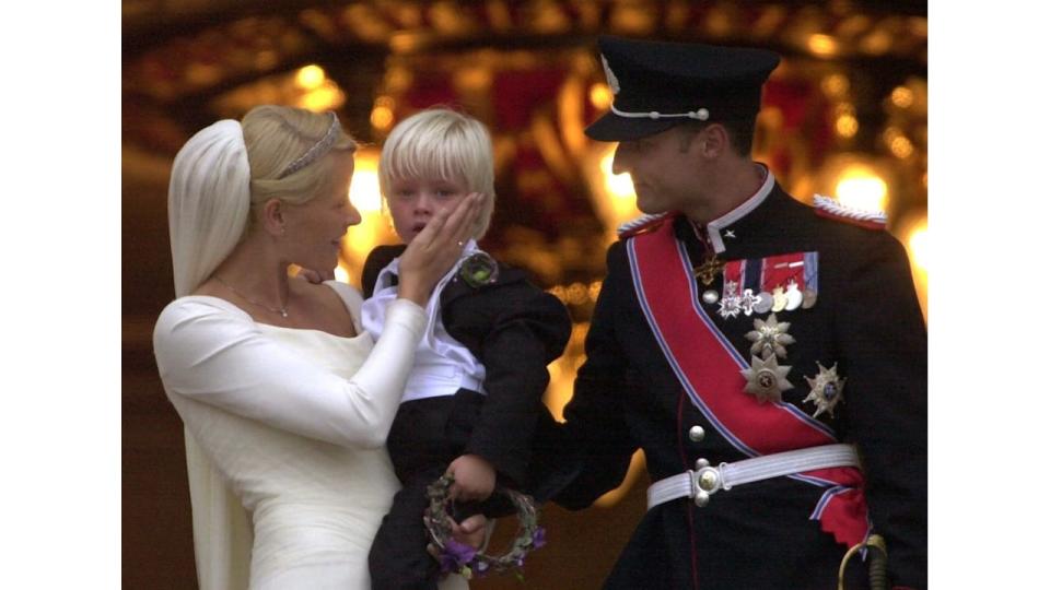 Crown Prince Haakon and new wife Crown Princess Mette-Marit with her son Marius at their 2001 wedding 