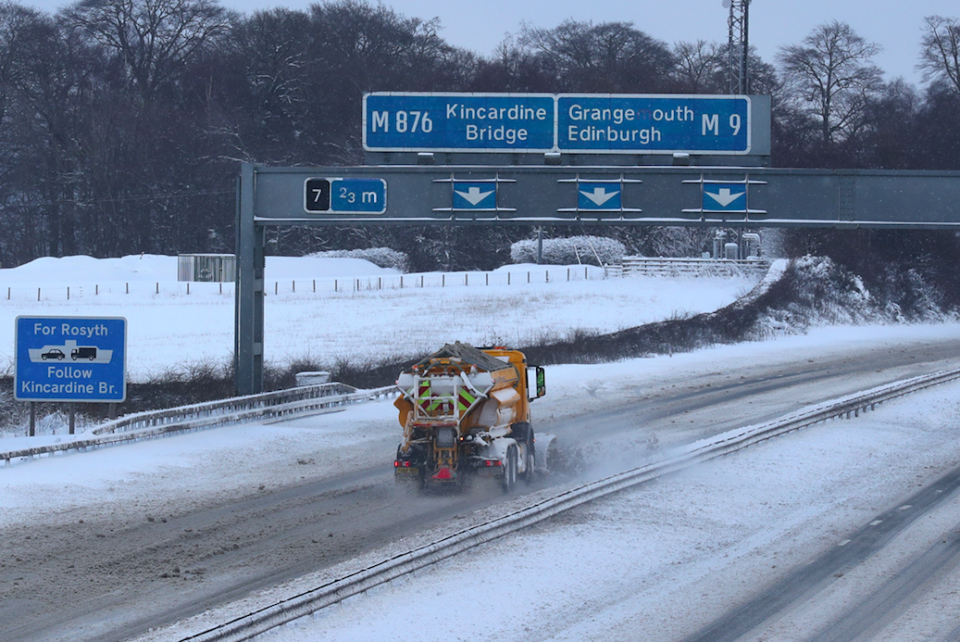 <em>A gritter on the M9 attempts to make the roads safer for drivers (PA)</em>