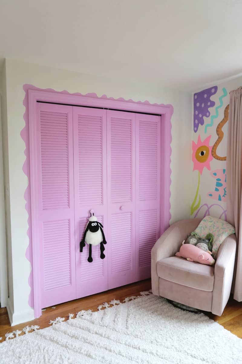 Purple painted closet door in kids room.