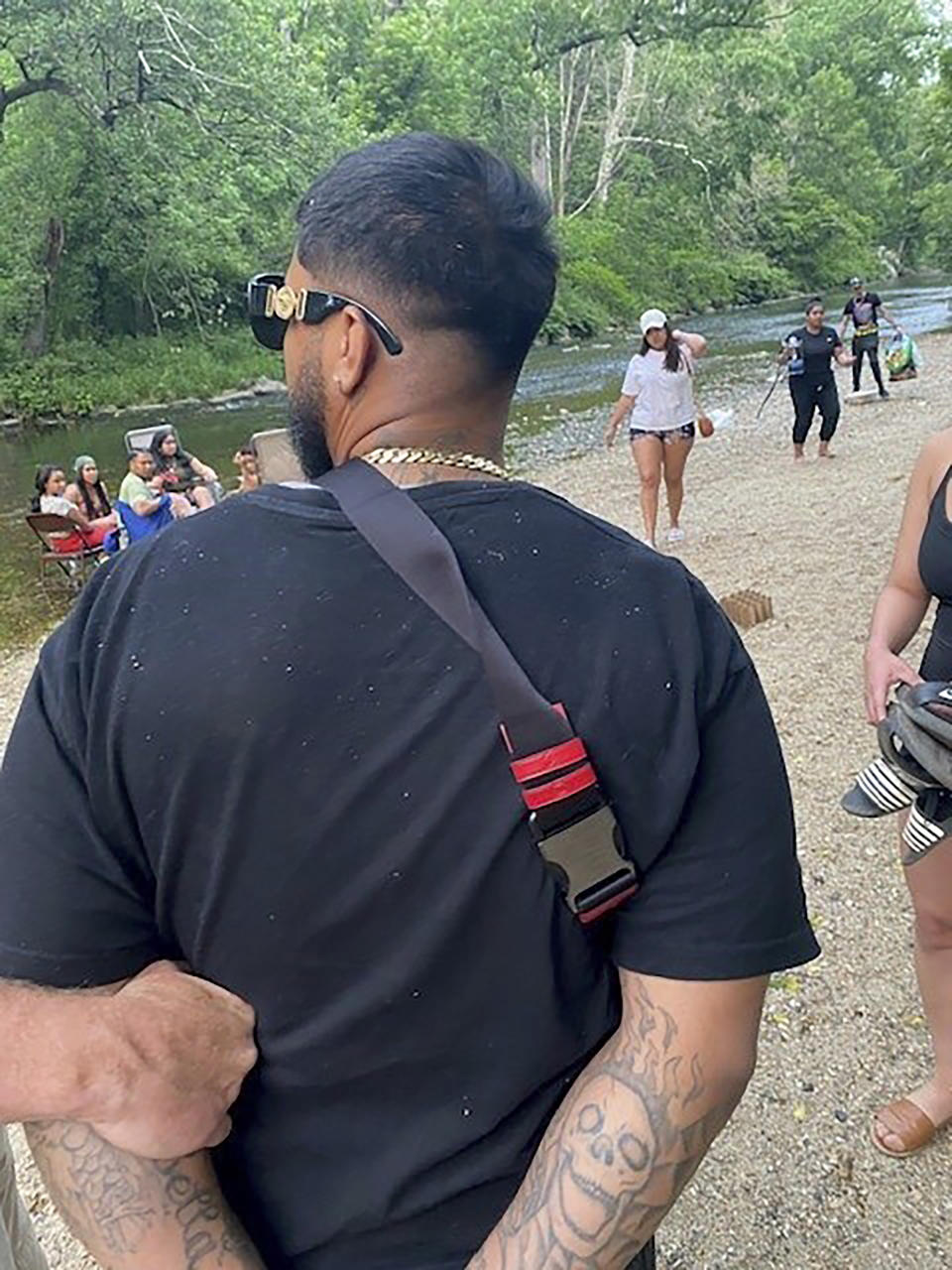 This photo provided by the U.S. Marshals Service shows officers arresting Ivan Claudio Rosero in Philadelphia, Tuesday, June 6, 2023. The fugitive wanted in the fatal shooting of three people, including two children who’d been playing with kittens in the back yard of their Pennsylvania home, has been captured in Philadelphia, federal officials said Wednesday. (U.S. Marshals Service via AP)