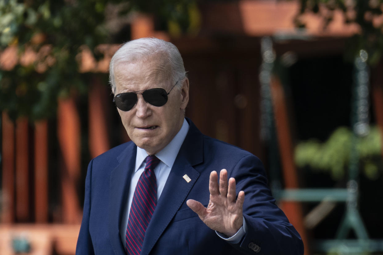 President Biden waves to the press as he walks to Marine One on the South Lawn of the White House July 28.