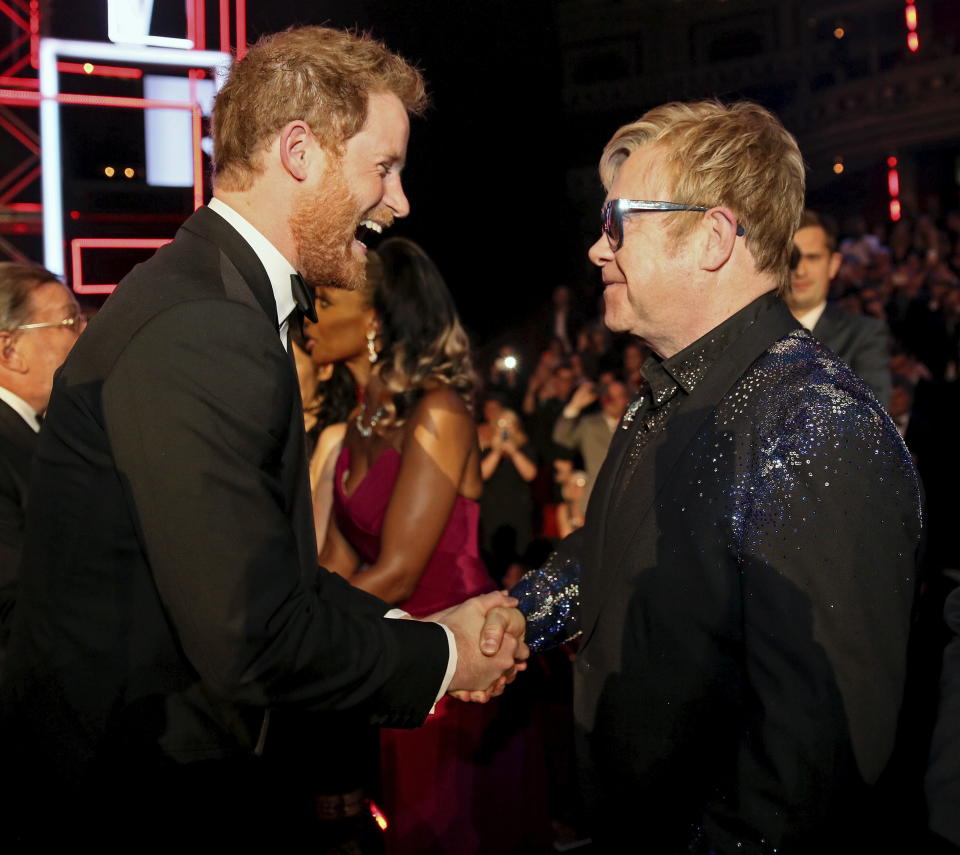 Prince Harry greets Elton John on Nov. 13, 2015.&nbsp; (Photo: Paul Hackett / Reuters)