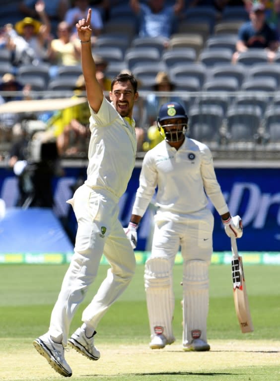 Australia's paceman Mitchell Starc (left) celebrates the dismissal of India's batsman Hanuma Vihari