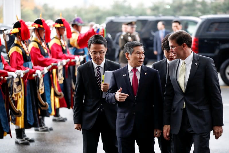 U.S. Secretary of Defense Mark Esper talks to South Korean Defense Minister Jeong Kyeong-doo upon his arrival to the Defense Ministry in Seoul