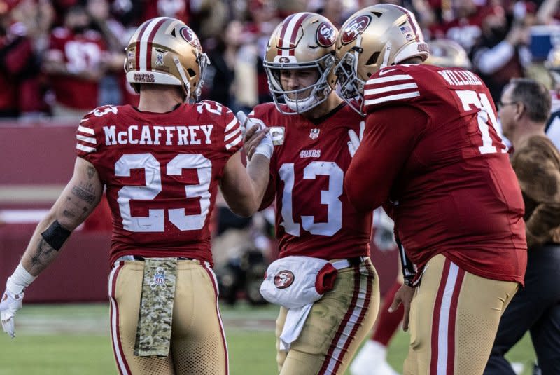 Running back Christian McCaffrey (L) scored two touchdowns in the San Fransisco 49ers' comeback win over the Detroit Lions in the NFC title game Sunday in Santa Clara, Calif. File Photo by Terry Schmitt/UPI