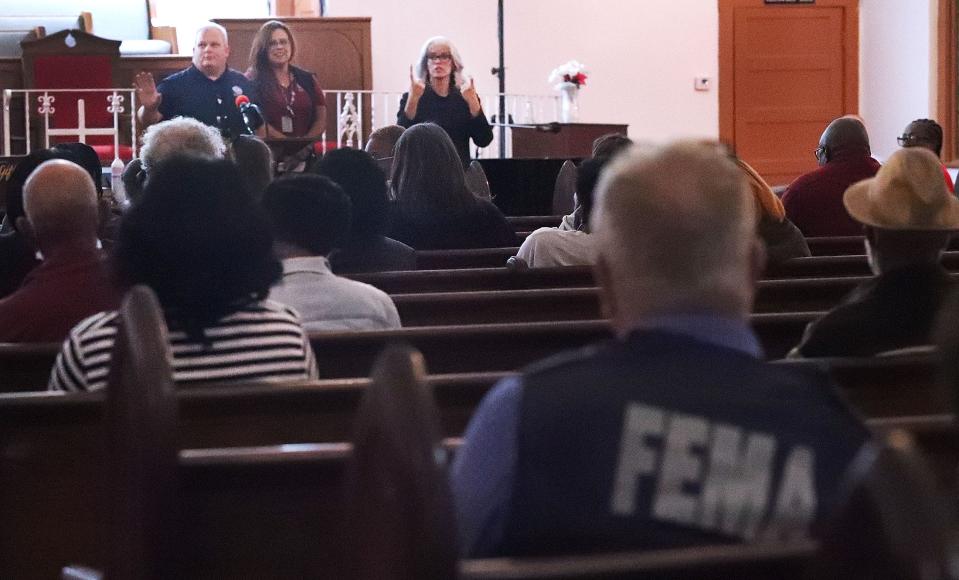FEMA officials speak to Midtown residents impacted by flooding from Tropical Storms Ian and Nicole Monday night at Mount Bethel Baptist Church.