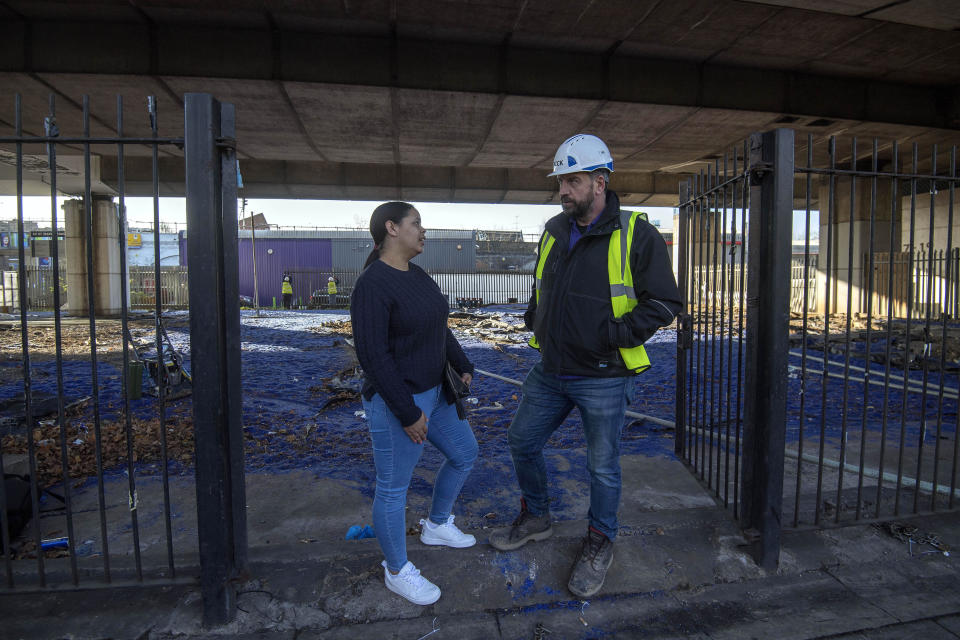 EMBARGOED TO 1200 MONDAY MARCH 26 BBC's DIY SOS Nick Knowles (right) talks with local resident Natasha Sadler on the site of a brand new multi-use community space and gym that his team are building for the Grenfell community on a site underneath the A40.