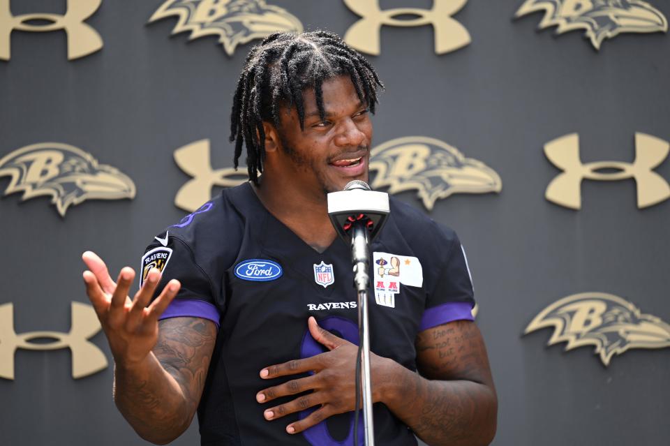Baltimore Ravens quarterback Lamar Jackson says photos reading "I Need $" is not a message to the team.