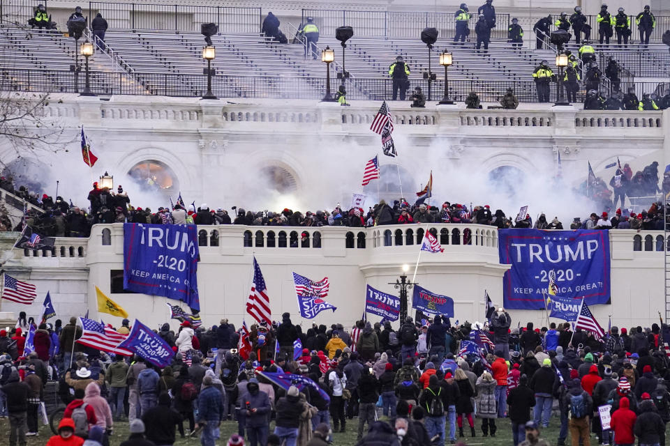 FILE - Rioters, loyal to President Donald Trump, storm the Capitol, Wednesday, Jan. 6, 2021, in Washington. Former President Donald Trump said during a debate with President Joe Biden last week that the attack on the Capitol involved a "relatively small" group of people who were "in many cases ushered in by the police." (AP Photo/John Minchillo, File)