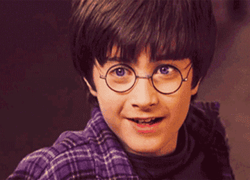 Daniel Radcliffe as Harry smiles in "Harry Potter and the Sorcerer's Stone"