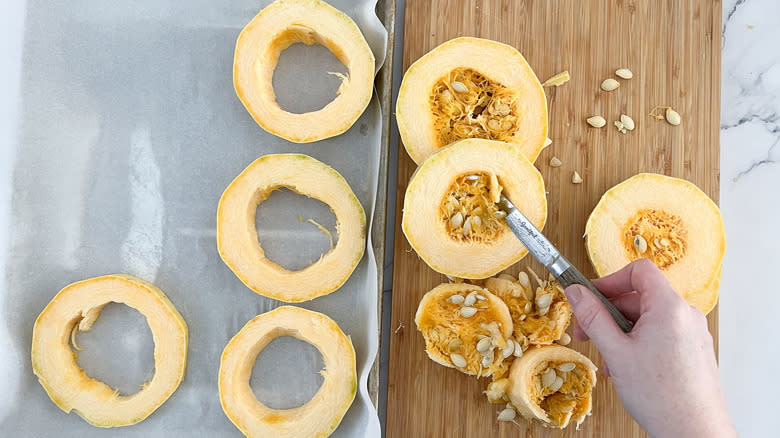 hand de-seeding spaghetti squash