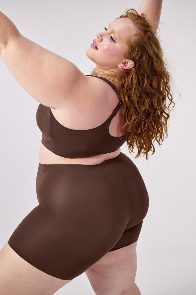 Lizzo wears cut-out leggings from new shapewear line to excitement