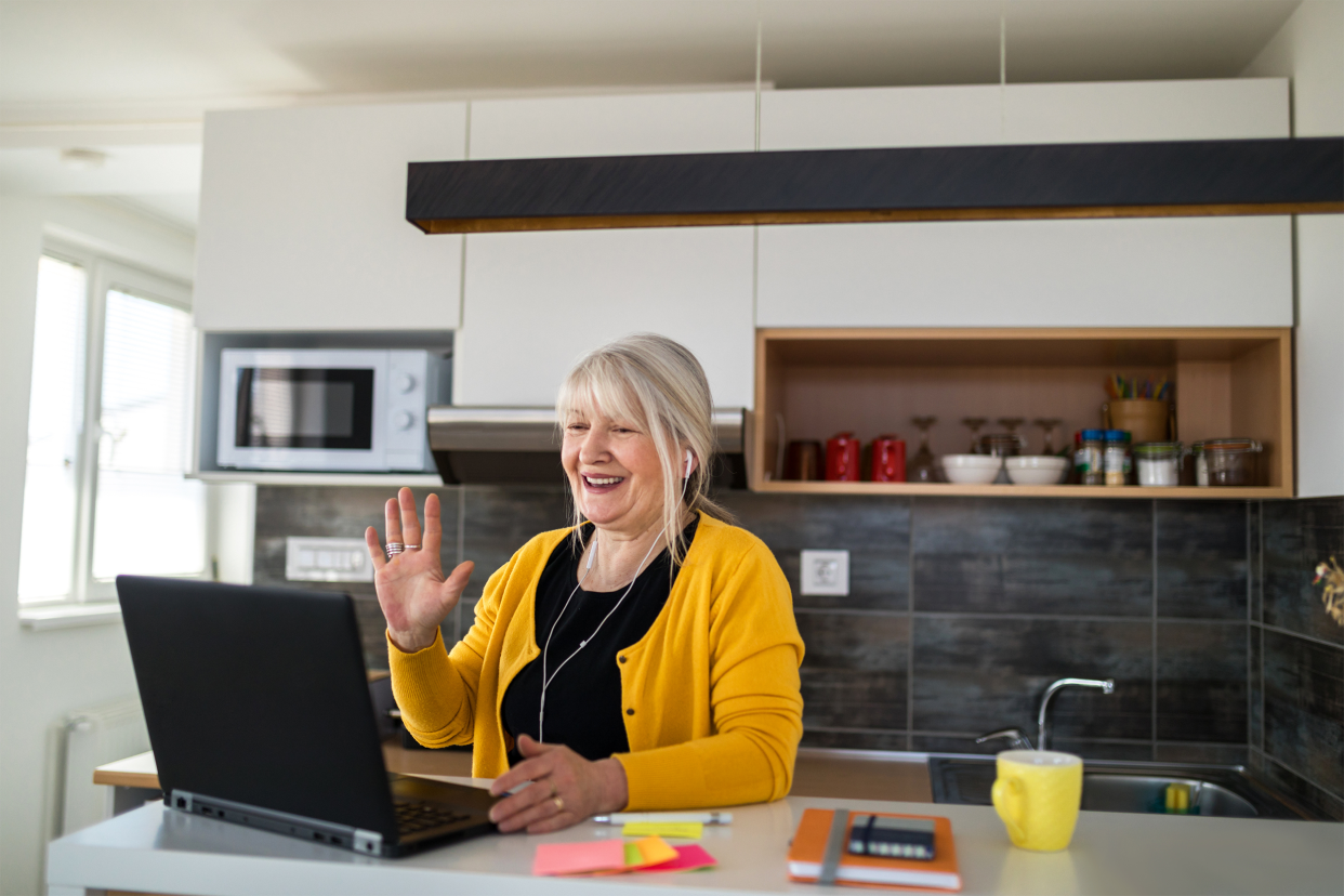 Businesswoman waving during online call