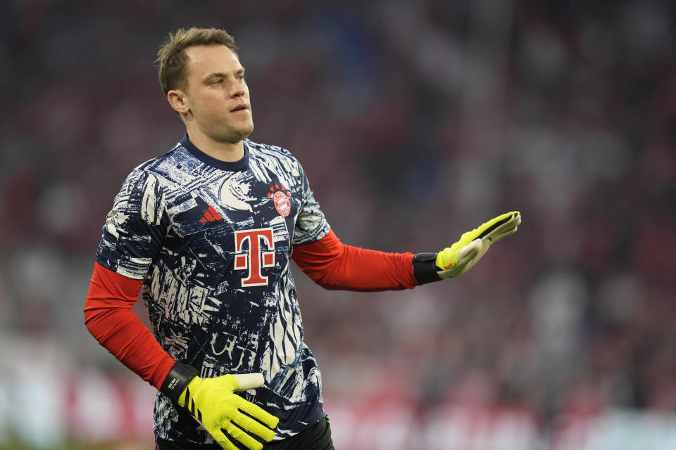 Bayern's goalkeeper Manuel Neuer applauds fans as he warms up prior to the Champions League semifinal first leg soccer match between Bayern Munich and Real Madrid at the Allianz Arena in Munich, Germany, Tuesday, April 30, 2024. (AP Photo/Matthias Schrader)