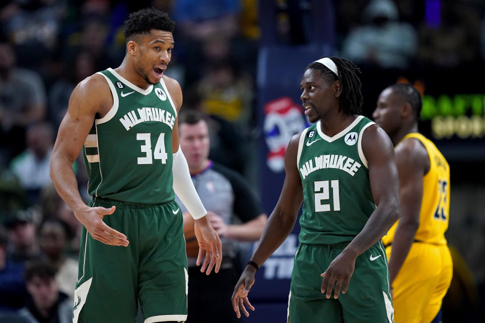 INDIANAPOLIS, INDIANA - JANUARY 27: Giannis Antetokounmpo #34 and Jrue Holiday #21 of the Milwaukee Bucks meet in the third quarter against the Indiana Pacers at Gainbridge Fieldhouse on January 27, 2023 in Indianapolis, Indiana. NOTE TO USER: User expressly acknowledges and agrees that, by downloading and or using this photograph, User is consenting to the terms and conditions of the Getty Images License Agreement. (Photo by Dylan Buell/Getty Images)