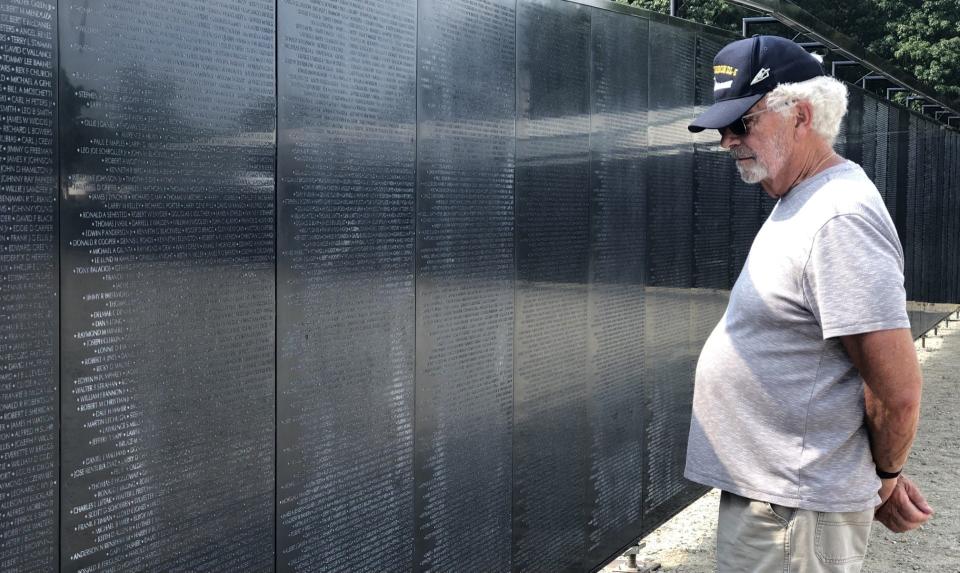 Tom Becker, of Wells, Maine, visits the Wall That Heals on Sept. 6, 2023. The wall, a scaled-down version of the Vietnam War Memorial in Washington, is on display on Route 109 in Sanford, Maine, through Sunday, Sept. 10, 2023.