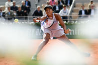 Japan's Naomi Osaka returns the ball to Slovakia's Anna Karolina Schmiedlova during their women's singles first round match on day three of The Roland Garros 2019 French Open tennis tournament in Paris on May 28, 2019. (Photo by Philippe Lopez/AFP/Getty Images)
