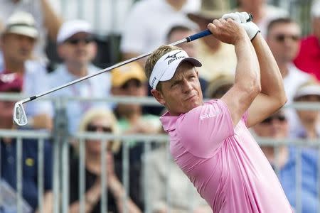 Mar 1, 2015; Palm Beach Gardens, FL, USA; Luke Donald tees off on the 1st hole during the third round of the Honda Classic at PGA National GC Champion Course. Mandatory Credit: Peter Casey-USA TODAY Sports